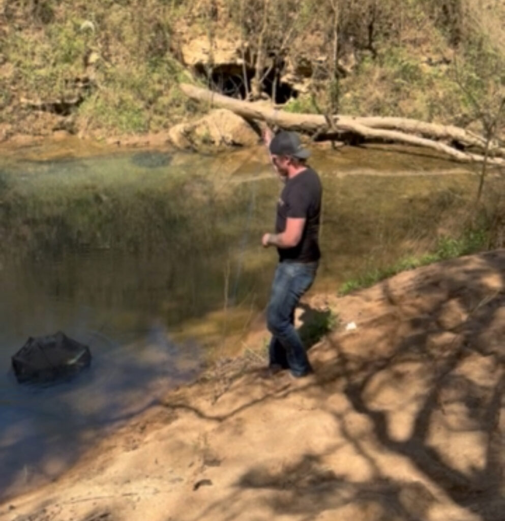 John catching crawfish at the Ingham Farm Spring in Sparta, TN